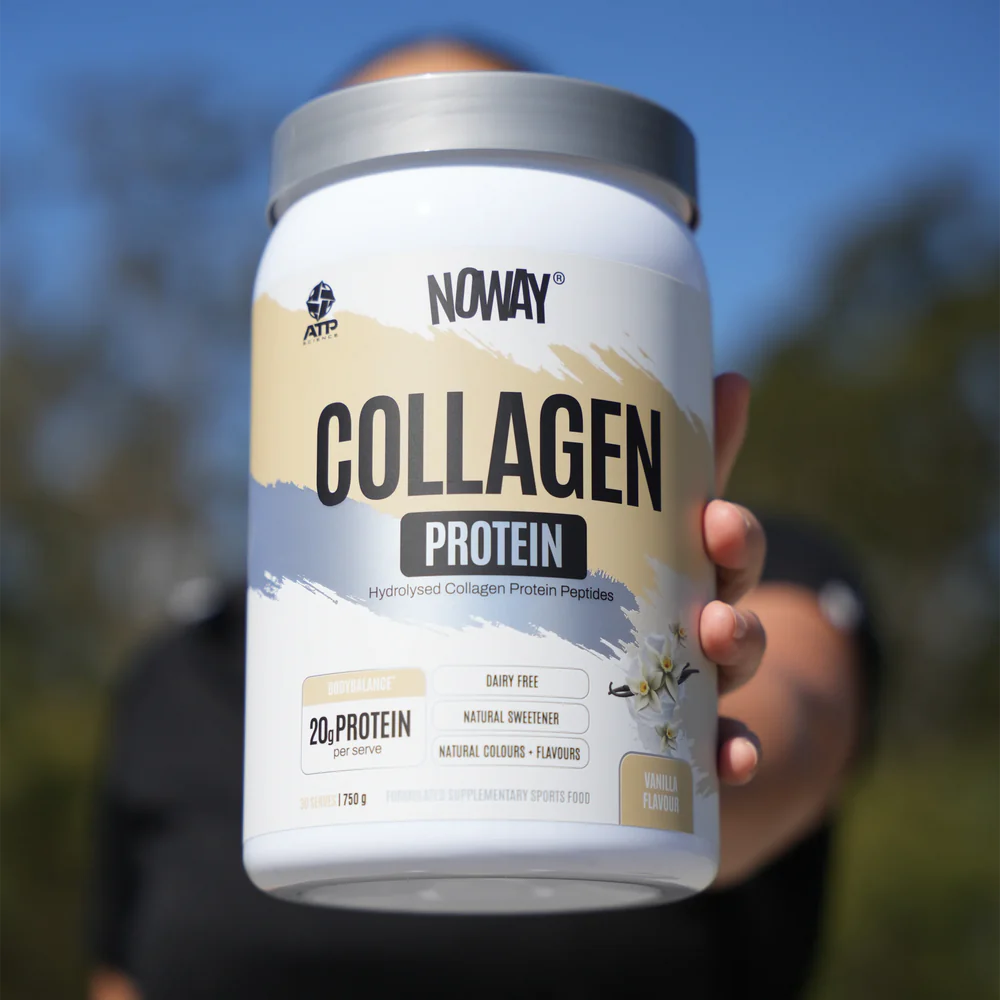 Person holding a container of Noway Collagen Protein with a blurred outdoor background