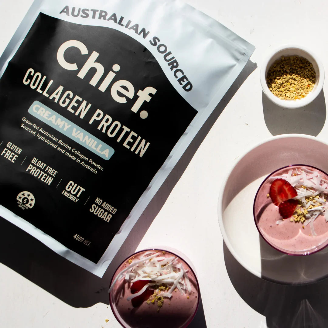 Chief. Collagen Protein pouch alongside a creamy pink smoothie, set on a light surface, promoting everyday use in drinks and recipes.