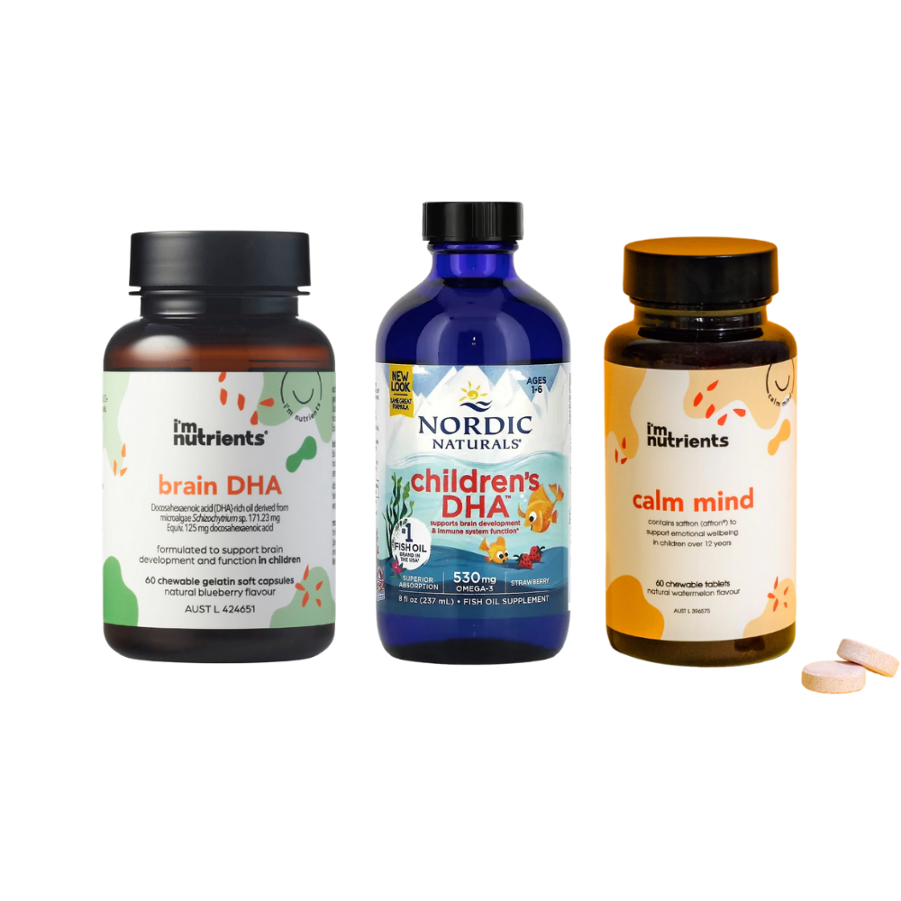 Three supplement bottles from I'm Nutrients and Nordic Naturals on a white background, with two pink tablets beside them. The bottles are labeled brain DHA, children's DHA, and calm mind.