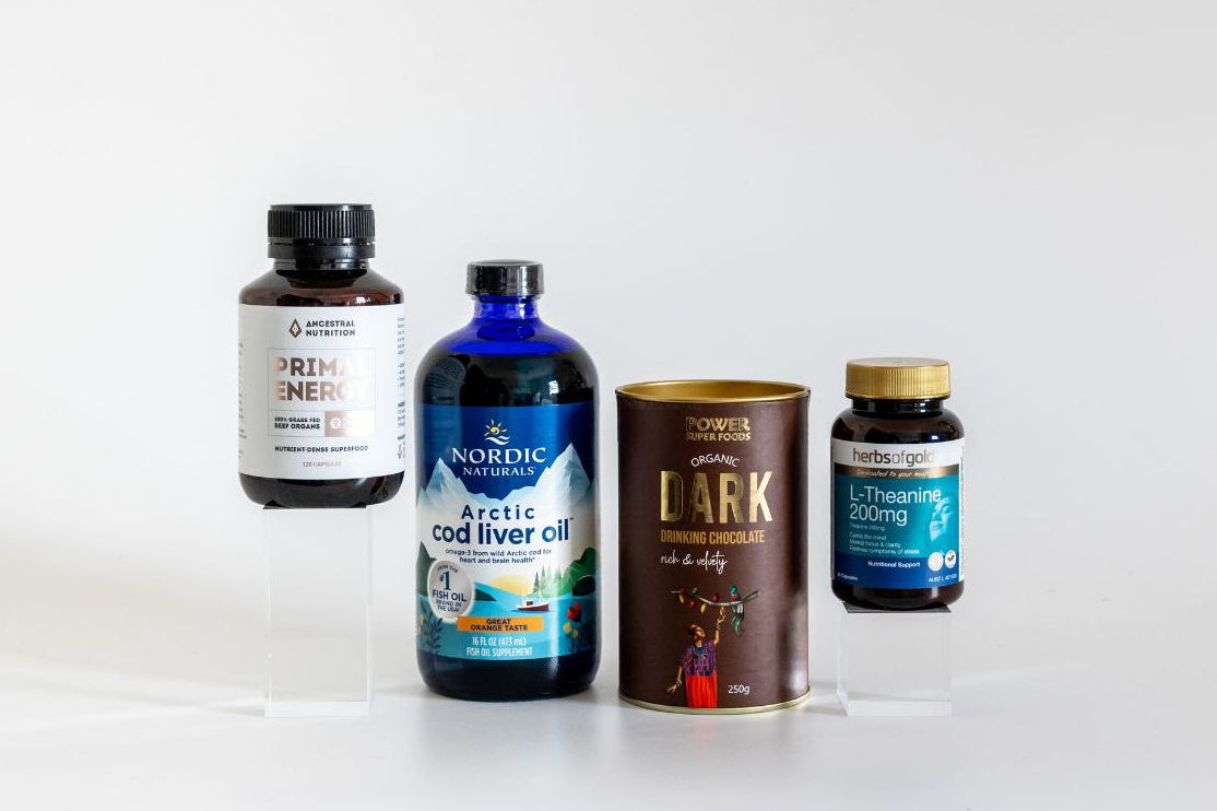 Naturopath-approved energy and focus supplements including Ancestral Nutrition Prima Energy, Nordic Naturals Arctic Cod Liver Oil, Herbs of Gold L-Theanine and Power Super Foods Dark Drinking Chocolate, available at Nourishing Apothecary
