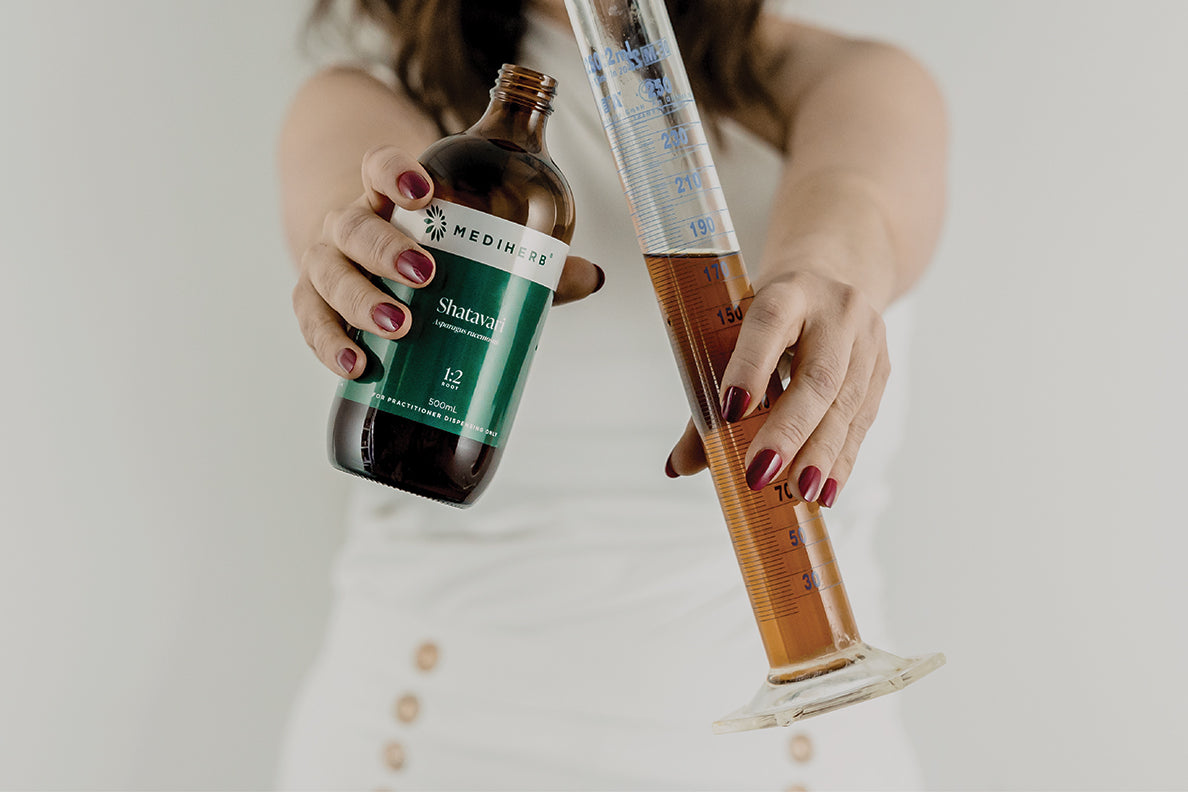 Jaime Chew formulating natural remedies, showcasing the art of creating holistic health solutions at Nourishing Apothecary.