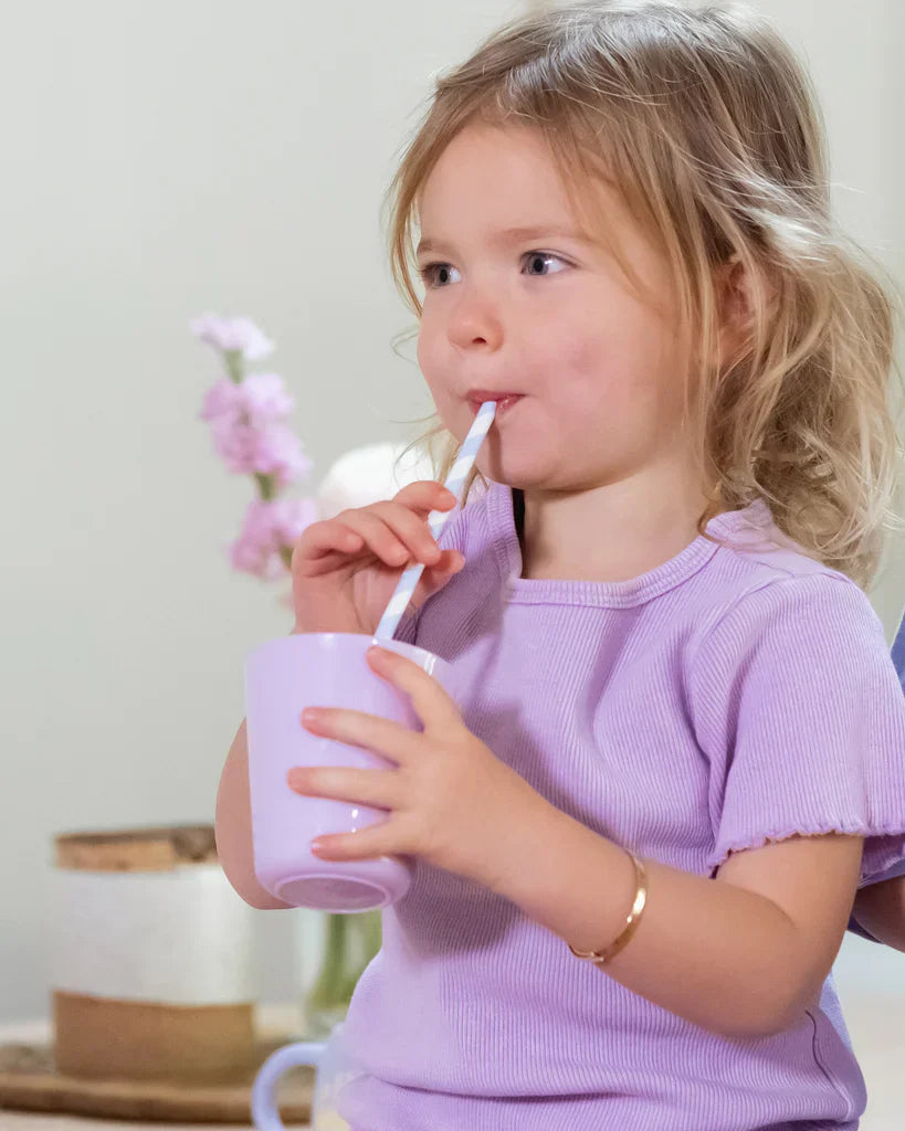 Child drinking a calming afternoon beverage made with Captain Calm