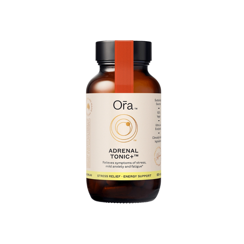 A bottle of Ora Adrenal Tonic+ supplement with a label that includes the product name and benefits such as stress relief and energy support.