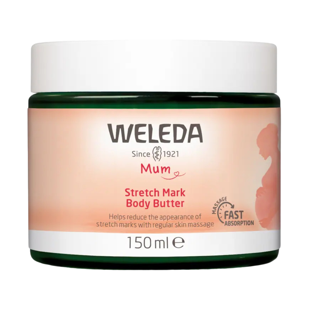 A container of Weleda Stretch Mark Body Butter, 150 ml size, with a pink and green label indicating it helps reduce the appearance of stretch marks with regular skin massage.