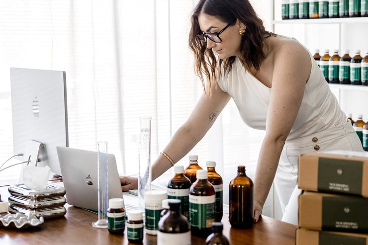 Jaime organising prescription orders at her Sydney clinic bench