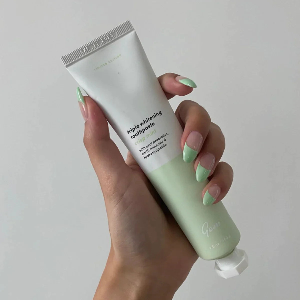 Crisp Mint toothpaste offering natural whitening and enamel care for a healthier smile without sensitivity or harsh chemicals.