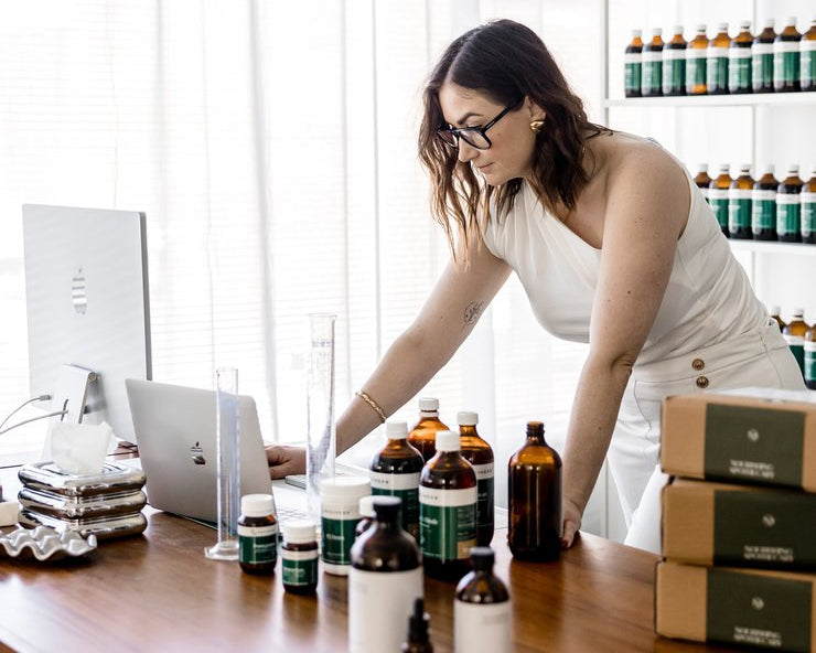 Jaime organising prescription orders at her Sydney clinic bench